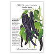 Seed packet for Pasilla Bajio Chilaca Chile Pepper featuring an illustration of long, slender dark purple-black peppers with mottled skin hanging among green leaves, with text noting it's frost sensitive, matures 80 days after transplanting, and describes its rich, smoky flavor used in mole and adobo sauces.
