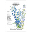 Seed packet for Shades of Blue Larkspur showing an illustration of tall spires with deep blue to pale blue-white bell-shaped flowers on slender green stems, with text noting it's a full-sun annual blooming spring to summer, growing 3'–4' tall, suited for cut and dried arrangements.