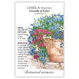 Seed packet for Cascade of Color Trailing Lobelia illustrated with an ornate terracotta planter overflowing with trailing blue, pink, and white flowers, alongside text noting it's an heirloom annual for full sun to part shade, blooming spring to frost, 6–8 inches long.