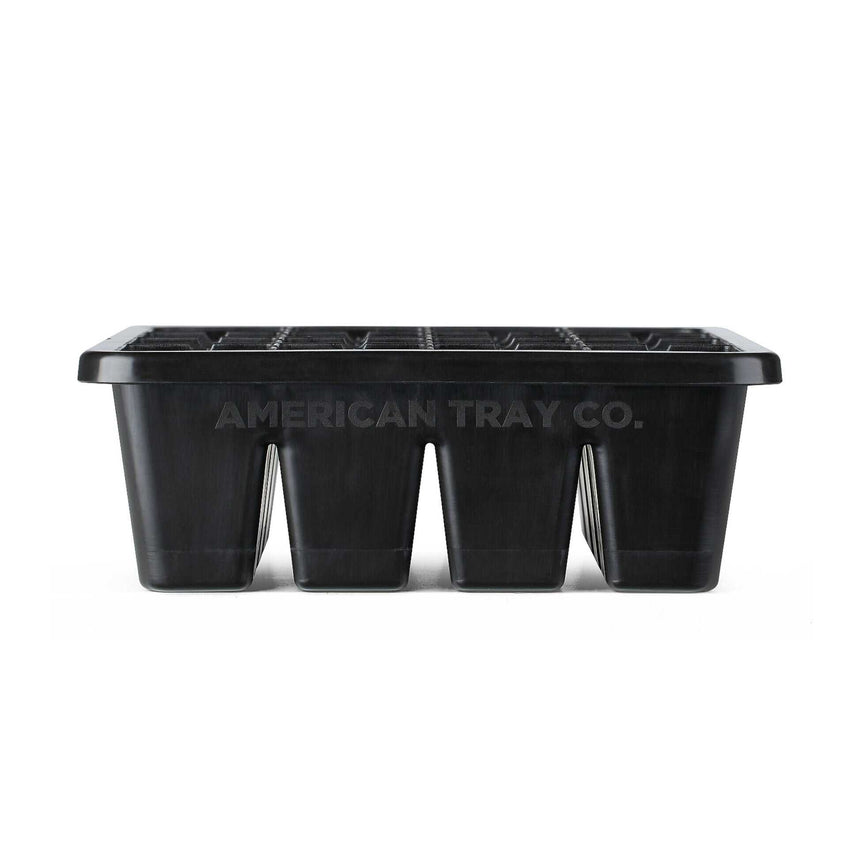 Black plastic 16-cell seed starting tray shown from the side, with molded individual planting cells and "American Tray Co." embossed along the front, against a plain white background.