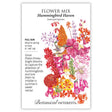 Front of a Botanical Interests seed packet for Hummingbird Haven Flower Mix Seeds featuring plant details and a detailed botanical illustration of colorful nectar-rich flowers with a hummingbird hovering in the center.