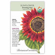 Seed packet for Evening Sun heirloom sunflower with a detailed illustration of a large red, orange, and gold bloom with a dark brown center on green leaves, labeled USDA Organic, annual, full sun, blooming summer to frost, growing 6 to 8 feet tall, described as ideal for cut flowers and attracting birds.