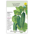 Seed packet for Botanical Interests organic heirloom Marketmore cucumber, illustrated with bumpy green cucumbers, curling tendrils, and a yellow blossom on the vine, with USDA Organic seal and text noting frost sensitivity, 60-day maturity, and a description praising its crisp, flavorful slicing fruit.