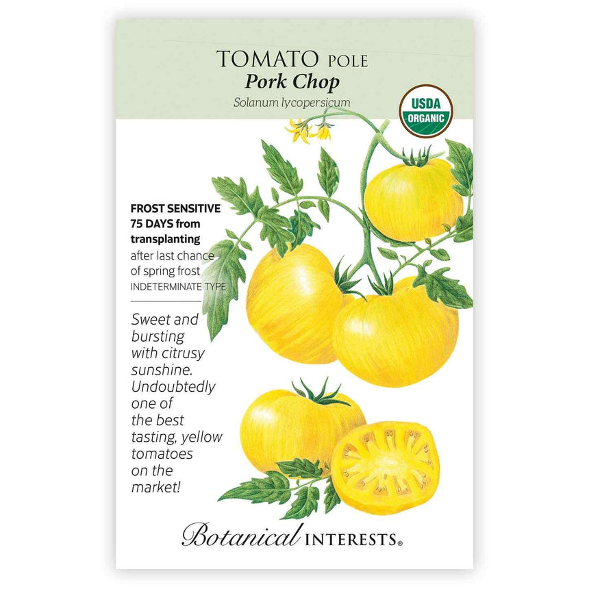 Front of a Botanical Interests "Tomato Pole Pork Chop" USDA Organic seed packet displaying illustrations and information of yellow beefsteak tomatoes on green vines with a cross-section on a white background.
