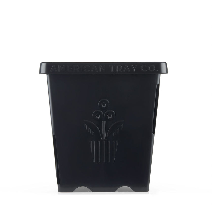 Black square plastic plant pot with tapered sides, embossed with an "American Tray Co." wordmark and a stylized three-flower motif on the front panel, shown against a plain white background.