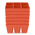 Stack of terracotta-coloured plastic seed starting trays, each divided into six square cells, shown nested together against a plain white background.