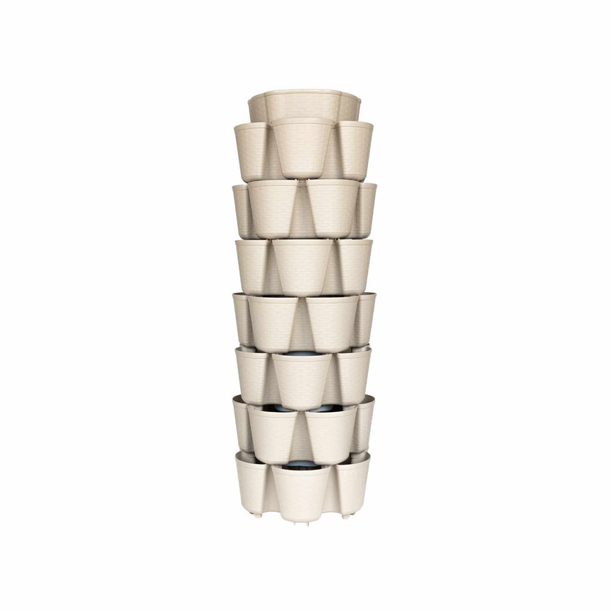 Tall stone-coloured GreenStalk vertical planter with seven stacked tiers of outward-facing basketweave-textured pots arranged in a spiral column, shown empty against a plain white background.
