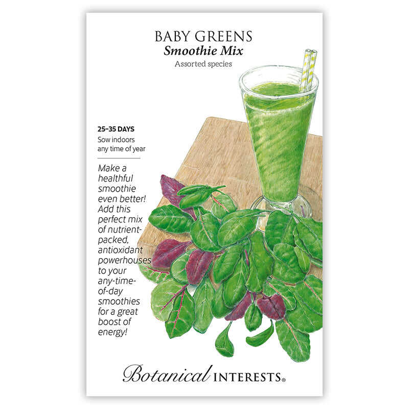 Seed packet for Baby Greens Smoothie Mix showing an illustrated glass of green smoothie with a striped straw beside a pile of mixed green and reddish-purple baby leaves on a wooden board, with text noting a 25-35 day growth period and sowing indoors year-round.