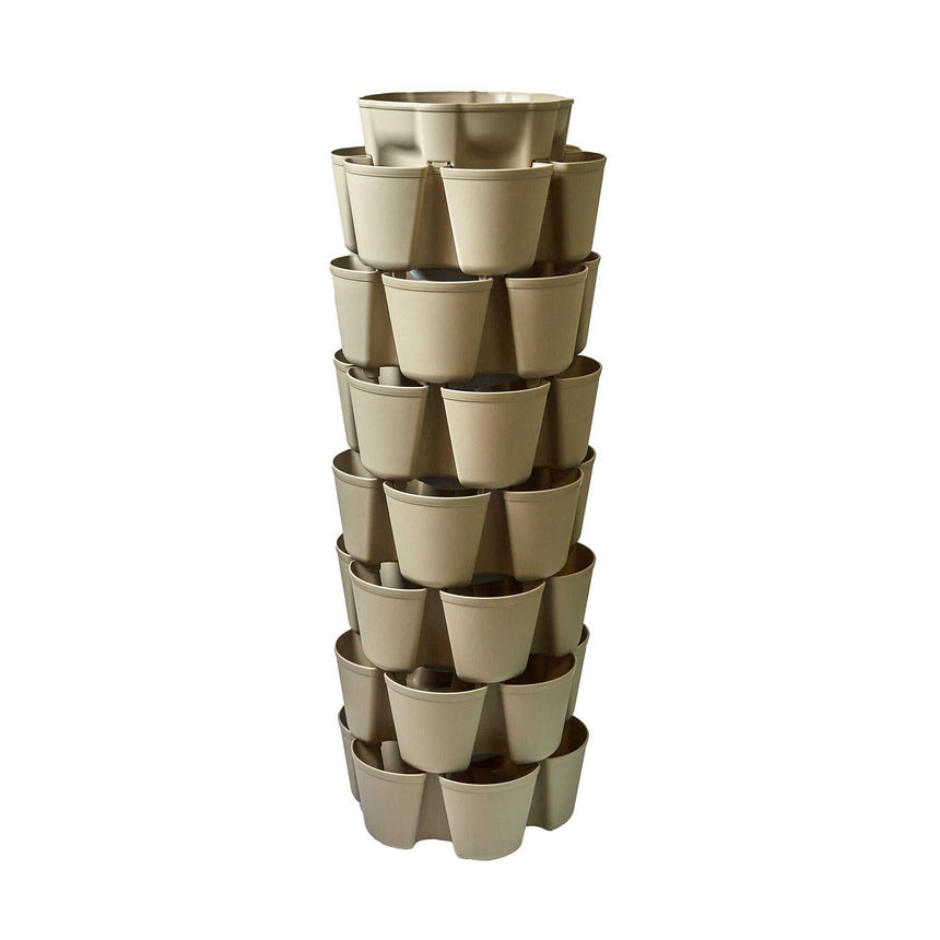 Empty stone-coloured GreenStalk 7-tier vertical planter tower with three planting pockets per level stacked in a spiral column, photographed against a plain white background.