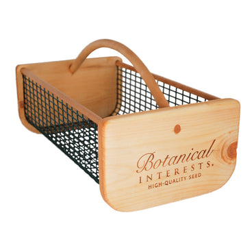 Wooden seed storage harvest basket with metal wire mesh and 'Botanical Interests HIGH-QUALITY SEED' logo printed on the front, set against a white background