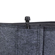 Close-up of a grey felt fabric grow bag's stitched rim, showing an integrated black plastic drip-irrigation fitting with a ribbed screw connector protruding from the top edge.