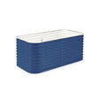 Empty rectangular raised garden bed with a corrugated dark blue metal exterior, rounded corners, and a white-lined interior, shown against a plain white background.