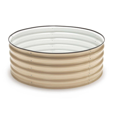 Round corrugated metal raised garden bed in beige with a white interior, short and wide with visible bolted seams, shown empty on a plain white background.