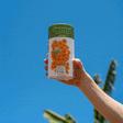 GIF of Orange California Poppy Seed Shaker being held and opened by a person