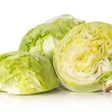 Two whole heads of pale green Great Lakes crisphead lettuce beside a halved head showing its tightly layered, crinkled white and green interior, on a white background.