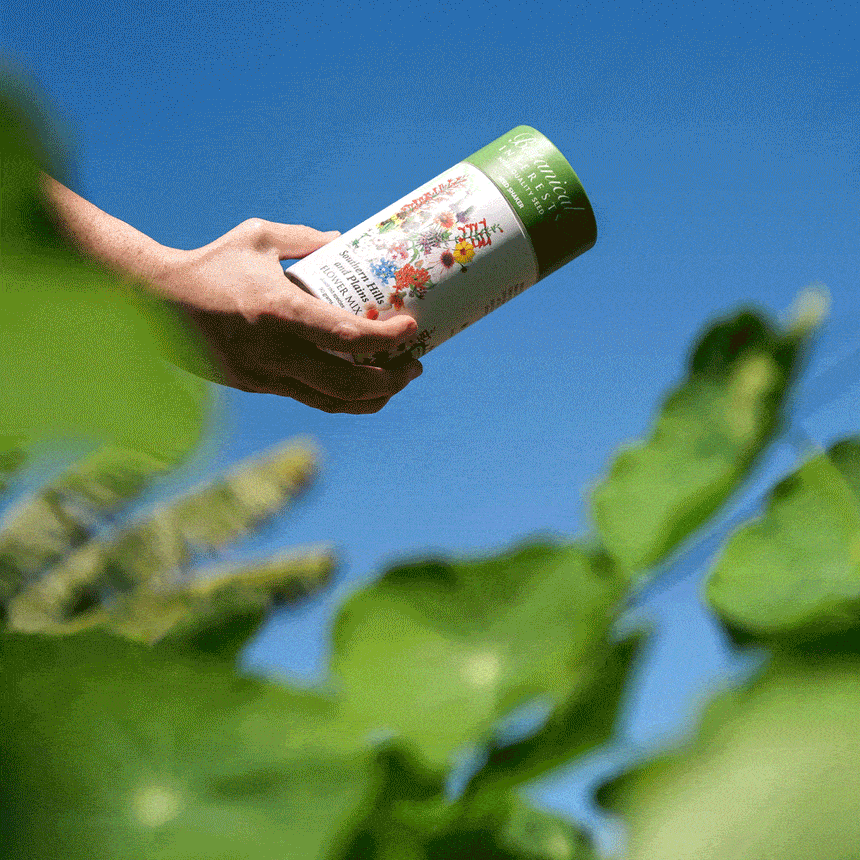 GIF of Southern Hills and Plains Flower Mix Seed Shaker being opened to spread the seeds on the ground.